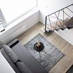 Aerial view of a stylish minimalist loft with modern furnishings and elegant decor.